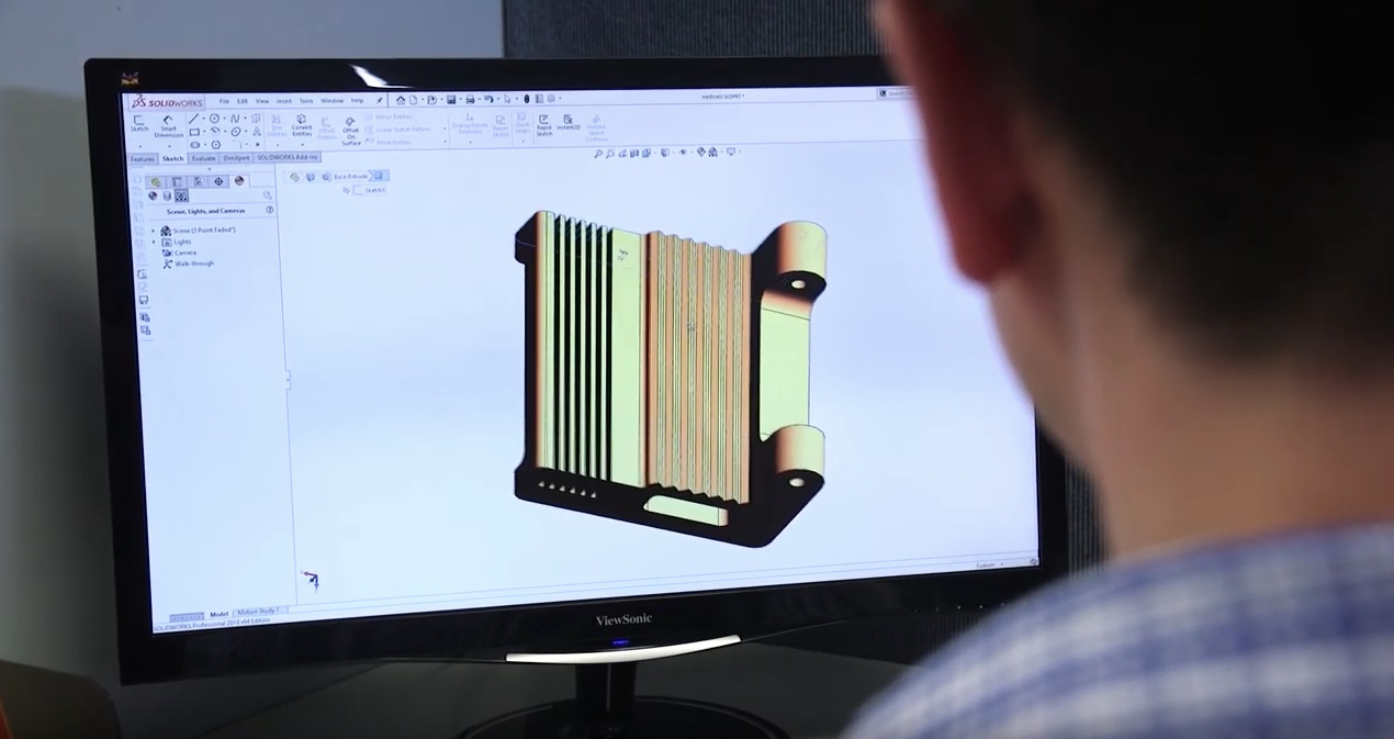 engineer using wire EDM programming software for wire EDM manufacturing